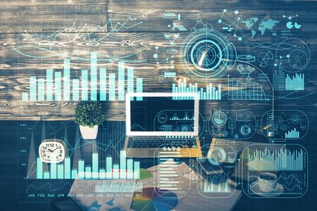 Double exposure of forex graph and work space with computer. Concept of international online trading.の写真素材