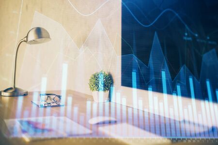 Stock market graph and table with computer background. Double exposure. Concept of financial analysis.の写真素材