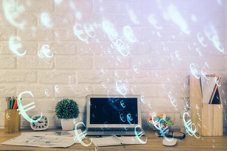 Financial graph colorful drawing and table with computer on background. Double exposure. Concept of international markets.の写真素材