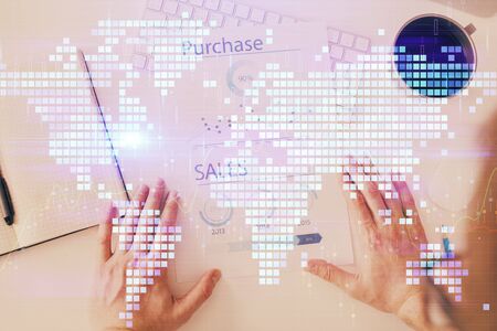Double exposure of hands and notepad with business icons.の写真素材