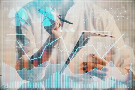 Financial chart drawn over hands taking notes background. Concept of research. Multi exposure