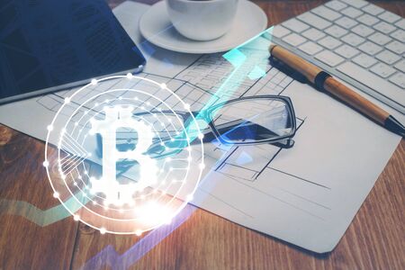 Crypto theme hologram with glasses on the table background. Concept of blockchain. Double exposure.の写真素材