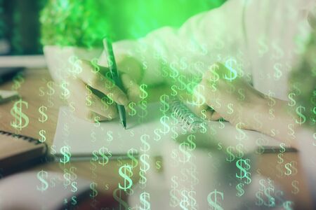 Financial forex graph displayed on hands taking notes background. Concept of research. Multi exposureの写真素材