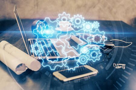 Double exposure of business theme icons and work space with computer background. Concept of success.