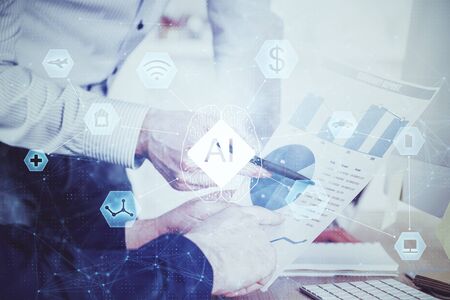 Writing mans hand with technology Ai icons.の写真素材