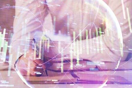 Double exposure of Man writing in notepad with business icons on background.の写真素材