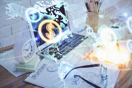 Forex market chart hologram and personal computer background. Multi exposure. Concept of investment.の写真素材