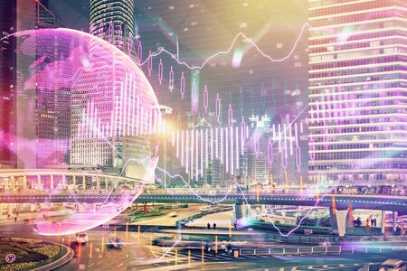 Financial chart on city scape with tall buildings background multi exposure. Analysis concept.の写真素材