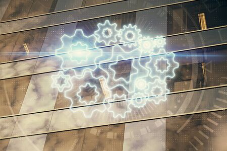 Double exposure of business theme hologram drawing and city veiw background. Concept of success.
