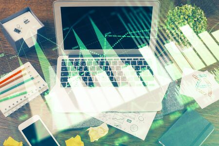 Multi exposure of forex chart and work space with computer. Concept of international online trading.の写真素材