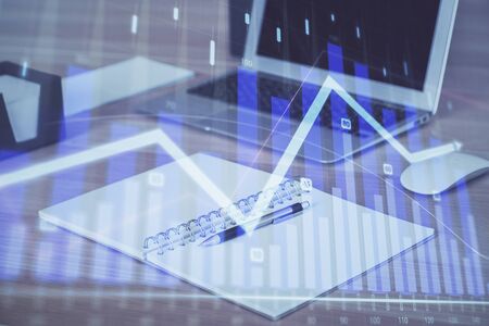 Double exposure of forex chart and work space with computer. Concept of international online trading.の写真素材