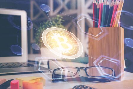 Crypto theme hologram with glasses on the table background. Concept of blockchain. Double exposure.の写真素材