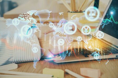 Multi exposure of stock market graph with man working on laptop on background. Concept of financial analysis.の写真素材