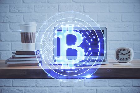 Multi exposure of blockchain theme hologram and table with computer background. Concept of bitcoin crypto currency.の写真素材
