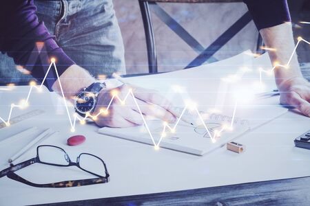Financial trading chart double exposure with man desktop background.の写真素材
