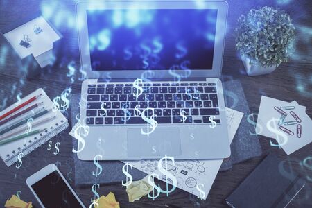 Financial graph colorful drawing and table with computer on background. Multi exposure. Concept of international markets.の写真素材