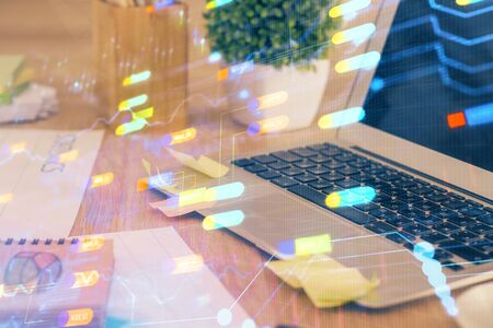 Technology theme drawing and table with computer. Double exposure. Concept of information.の写真素材