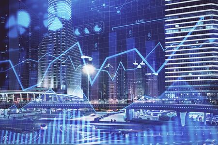 Financial chart on city scape with tall buildings background multi exposure. Analysis concept.の写真素材