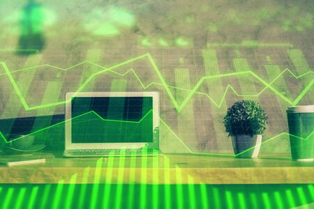 Double exposure of forex graph and work space with computer. Concept of international online trading.の写真素材