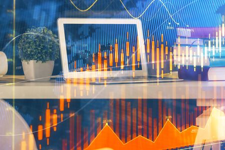 Double exposure of forex chart and work space with computer. Concept of international online trading.の写真素材