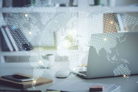 Multi exposure of business theme icons and table with computerの写真素材