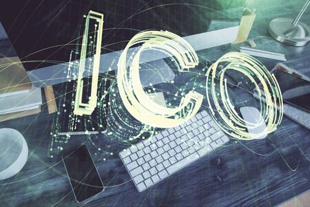 Double exposure of blockchain and crypto economy theme hologram and table with computerの写真素材