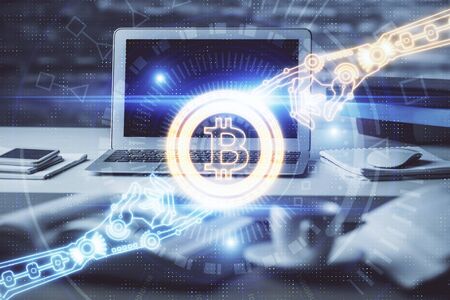 Multi exposure of blockchain theme hologram and table with computer background. Concept of bitcoin...