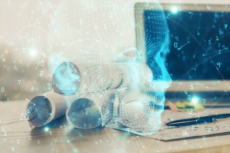 Double exposure of table with computer and brain hologram. Data innovation concept.
