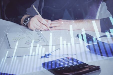 Double exposure of man doing analysis of stock market with forex graph.