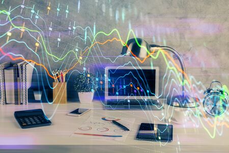 Double exposure of forex graph and work space with computer. Concept of international online trading.の写真素材
