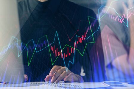 Forex graph with businessman typing on computer in office on background. Concept of analysis. Double...