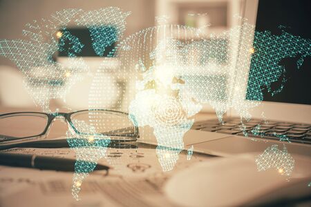 Business theme hologram with glasses on the table background. Concept of search. Double exposure.の写真素材