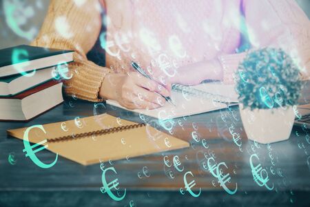 Forex graph on hand taking notes background. Concept of research. Double exposureの写真素材