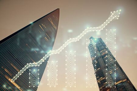 Forex chart on cityscape with tall buildings background multi exposure. Financial research concept.