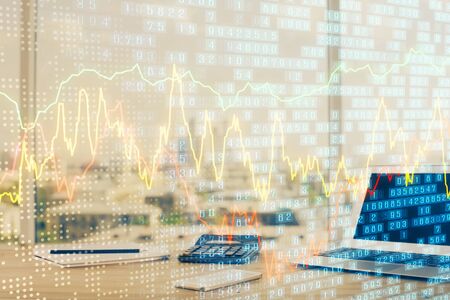 Stock market graph and table with computer background. Double exposure. Concept of financial...