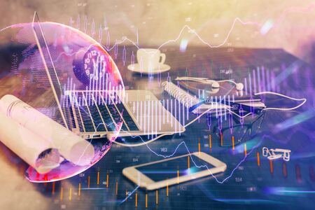Double exposure of forex chart and work space with computer. Concept of international online trading.の写真素材