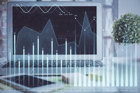 Stock market graph and table with computer background. Multi exposure. Concept of financial analysis.の写真素材