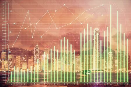 Multi exposure of forex chart drawings over cityscape background. Concept of success.