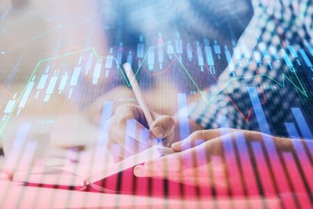 Multi exposure of two men planing investment with stock market forex chart.