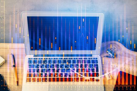 Double exposure of forex graph and work space with computer. Concept of international online...
