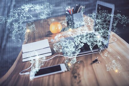 Computer on desktop with social network theme icon. Multi exposure. Concept of international connections.の写真素材