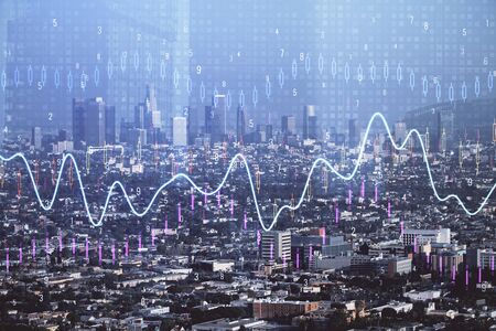 Forex chart on cityscape with skyscrapers wallpaper double exposure. Financial research concept.の写真素材