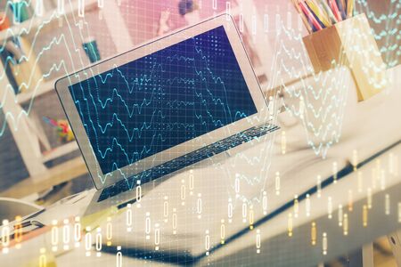 Forex market chart hologram and personal computer background. Multi exposure. Concept of investment.