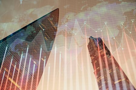 Forex chart on cityscape with tall buildings background multi exposure. Financial research concept.の写真素材