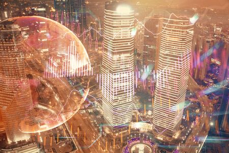 Financial chart on city scape with tall buildings background multi exposure. Analysis concept.の写真素材