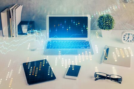 Stock market graph and table with computer background. Multi exposure. Concept of financial analysis.の写真素材