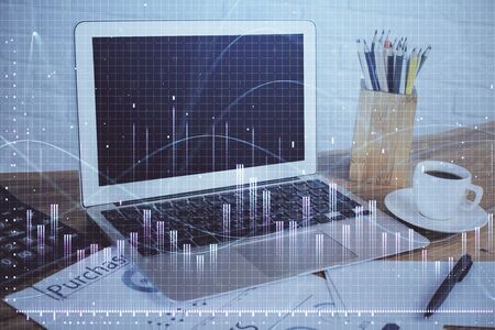 Stock market graph and table with computer background. Multi exposure. Concept of financial analysis.の写真素材