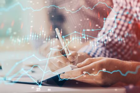 Multi exposure of two men planing investment with stock market forex chart.