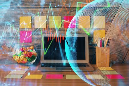 Double exposure of forex graph and work space with computer. Concept of international online trading.の写真素材