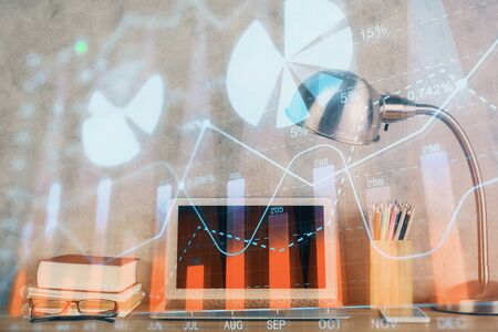 Multi exposure of graph and financial info and work space with computer background. Concept of international online trading.の写真素材